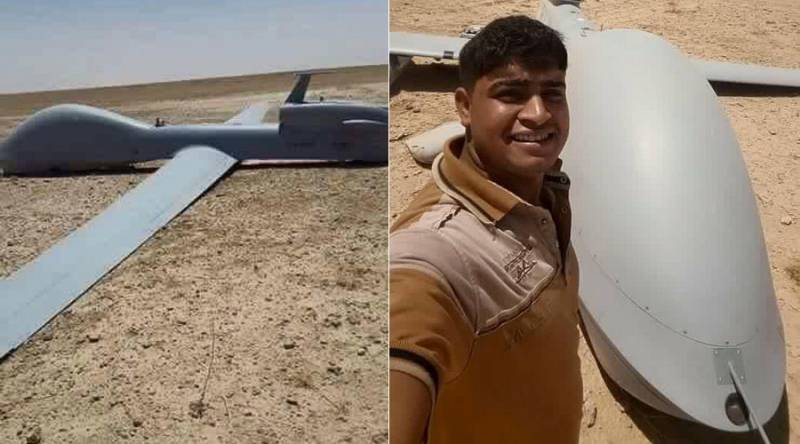 US unmanned aircraft crashes in Iraq desert, locals pose for selfies