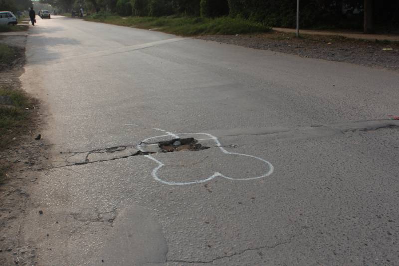 Mystery artist draws penises around Islamabad potholes