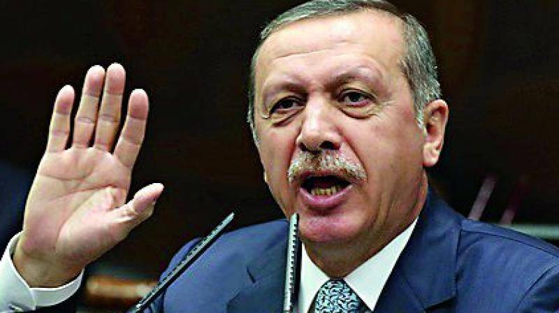 Erdogan refuses to bow to key condition on visas