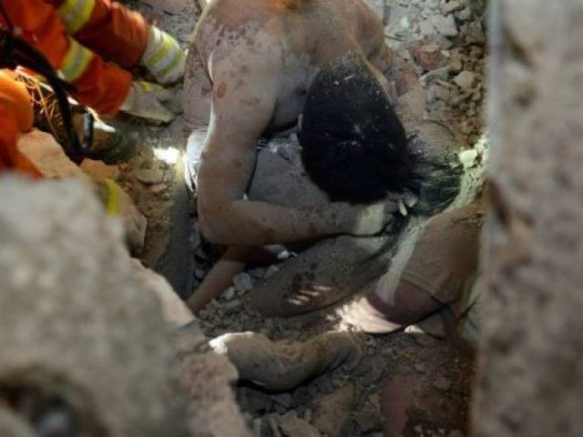 Father's last embrace saves 3-year-old daughter in China building collapse
