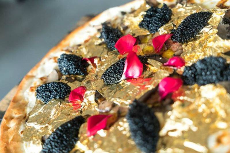 Cheesy rich! So, you think you can afford this $2,000 pizza covered in edible 24K GOLD?