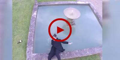Woman falls into pond while posing for funny aerial shot