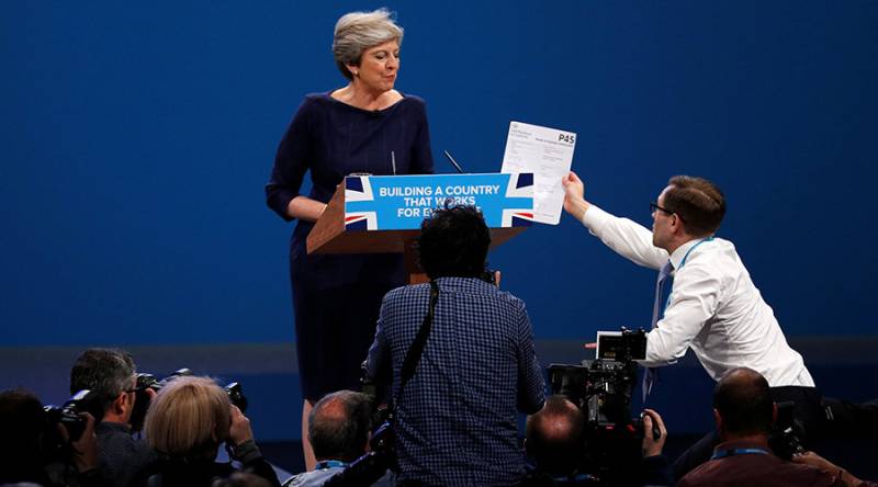 Theresa May's speech interrupted by prankster handing over P45 dismissal notice (VIDEO)
