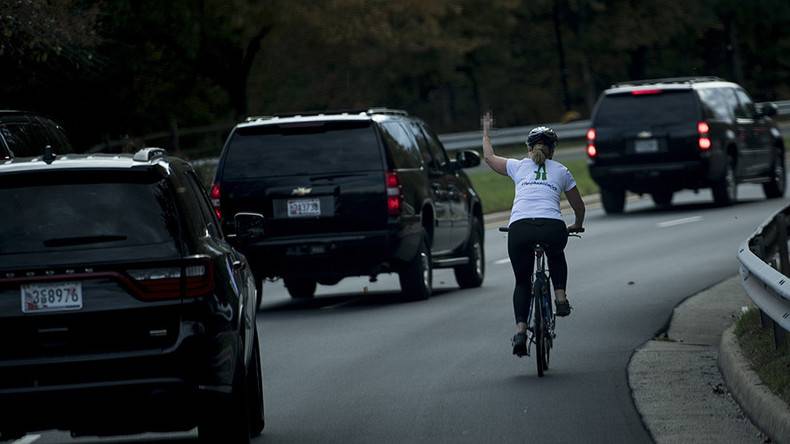 Female cyclist gives Trump's motorcade 'middle-finger' salute