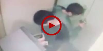 CCTV footage shows two Chinese tempering ATM in Karachi
