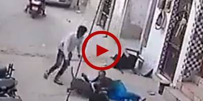 Pit bull dog attacks kids playing in street in India (Video)