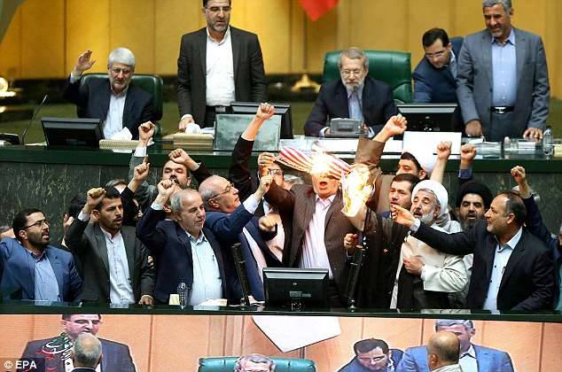'Death to America': Iranian politicians set fire to US flag in parliament