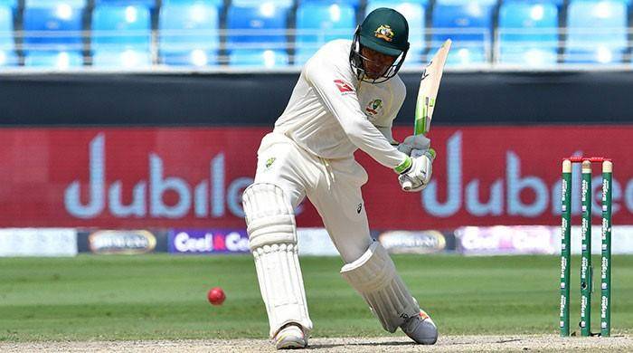 Ton-up Khawaja defies Pakistan's victory push