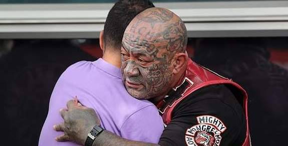 Rival gangs are seen consoling each other after the Christchurch massacre