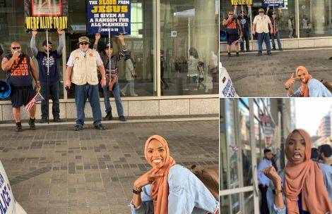 Muslim woman goes viral after posing in front of anti-Muslim protestors
