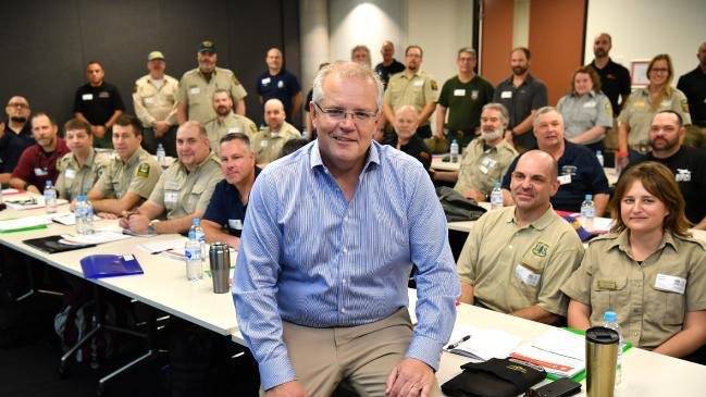 Australian PM apologizes for going on holiday amid wildfire emergency
