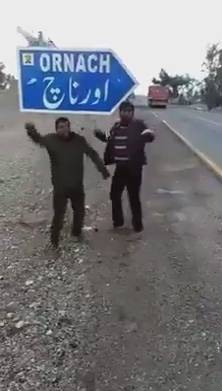 What makes these boys dance hilariously beside a signboard in Pakistan? (VIDEO)