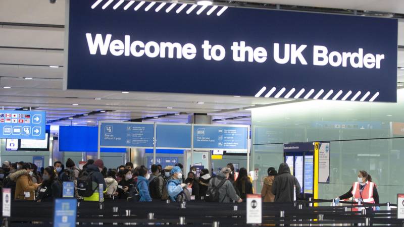 UK announces test and quarantine rules for travelers as Omicron variant triggers alarm