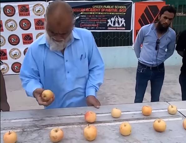 70-year-old Pakistani sets world record by crushing most apples in one minute (VIDEO)