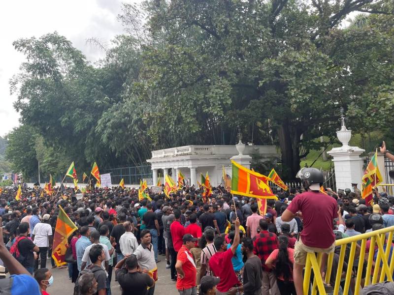 Sri Lanka’s Rajapaksa flees after protesters storm presidential residence amid worst financial crisis