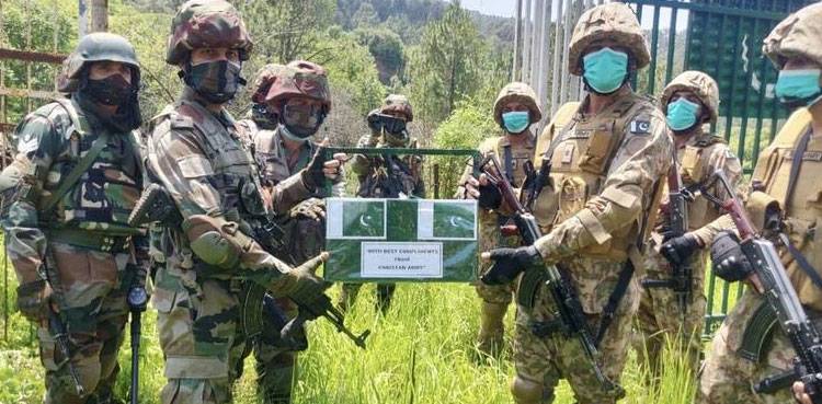 Pakistani, Indian border forces exchange sweets in customary Eid greetings