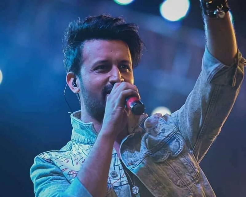How much did Atif Aslam earn from his two Bollywood songs?