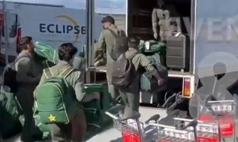 Pakistani players unload their luggage after arriving in Australia