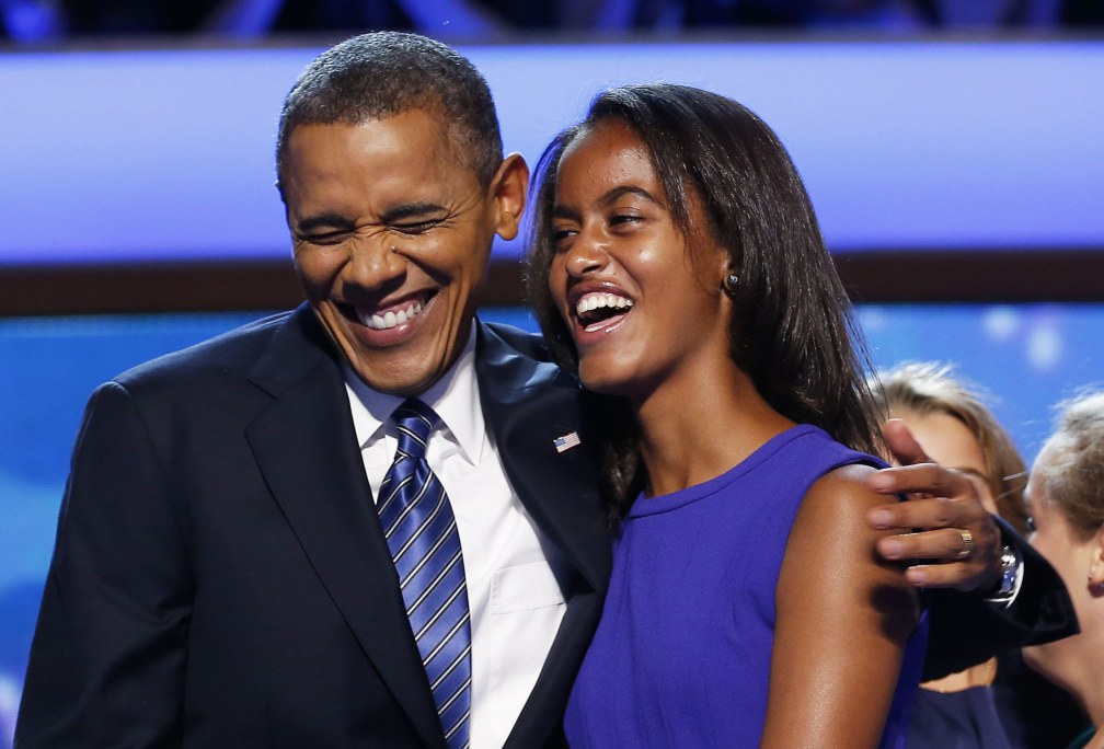 U.S. President Barack Obama celebrates with his daughter Malia (R) after accepting the 2012 U.S Democratic presidential nomination during the final session of Democratic National Convention in Charlotte, North Carolina, America. September 6, 2012. REUTERS/Jim Young (UNITED STATES - Tags: ELECTIONS POLITICS)
