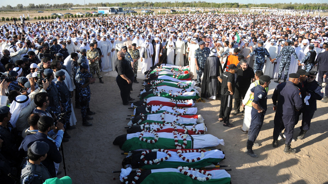 epa04821512 Thousands of Kuwaitis attend the funeral for some of the victims killed in the suicide bombing on the Imam Sadiq Mosque in al-Sawaber, in the Sulaibikhat Cemetery, Kuwait City, Kuwait, 27 June 2015. According to reports 26 June 27 people were killed and over 200 wounded in a suicide bombing at a Shiite mosque in Kuwait where worshippers had gathered for Friday prayers during the holy month of Ramadan. The perpetrator, ellegedly affiliated with the so-called Islamic State (IS), claimed responsibility for the attack, according to a statement circulated on social media which could not be immediately verified. EPA/RAED QUTENA