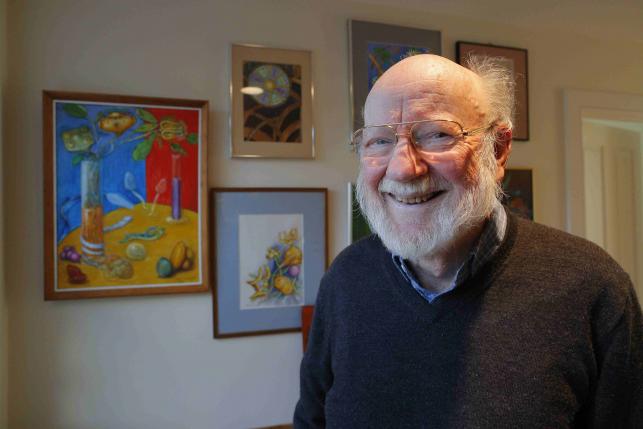 William C. Campbell, a parasitologist and RISE Associate with Drew University, poses near paintings he made of parasites shortly after learning that he was a co-winner of the Nobel Prize for medicine, at his home in North Andover, Massachusetts October 5, 2015. REUTERS/Brian Snyder
