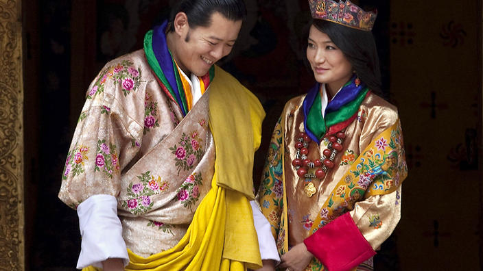 FILE - This Oct. 13, 2011 file photo Queen Jetsun Pema, right, looks at King Jigme Khesar Namgyal Wangchuck as they pose after they were married at the Punakha Dzong in Punakha, Bhutan. The tiny Himalayan nation of Bhutan has a new crown prince. The Royal Media Office in capital Thimphu said Saturday that the baby boy was born on Friday. (AP Photo/Kevin Frayer, File)