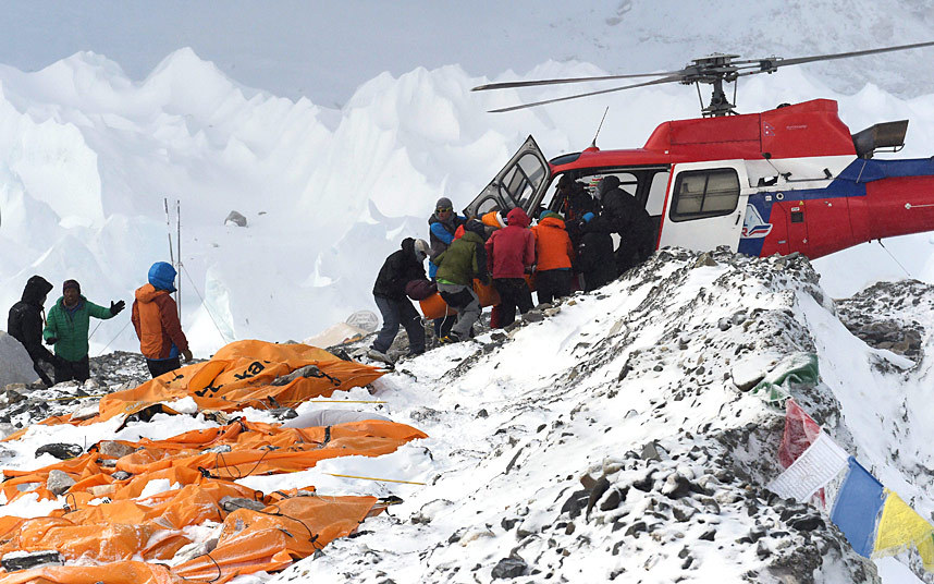 An injured person is loaded onto a helicopter, following an avalanche on Mount Everest triggered by an earthquake in Nepal.–AFP