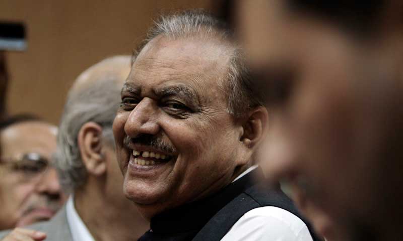 Mamnoon Hussain, presidential candidate of the Pakistan Muslim League-Nawaz (PML-N) party, smiles as he submits his nomination papers for the upcoming presidential election at the High Court in Islamabad July 24, 2013. Pakistan’s ruling party has chosen a former governor of the southern province of Sindh as its presidential candidate, paving the way for a sure shot victory in the presidential polls due to be held on July 30. Mamnoon Hussain, a veteran politician who has been an active member of Prime Minister Nawaz Sharif's Pakistan Muslim League-Nawaz (PML-N) since the sixties, is the front-runner for the president’s office once President Asif Ali Zardari’s term expires in September. REUTERS/Faisal Mahmood (PAKISTAN - Tags: POLITICS ELECTIONS)