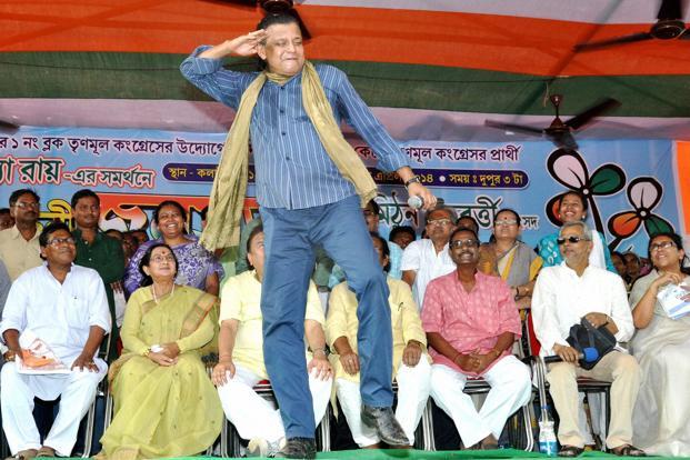 Bollywood actor and TMC MP Mithun Chakraborty dances during an election campaign.