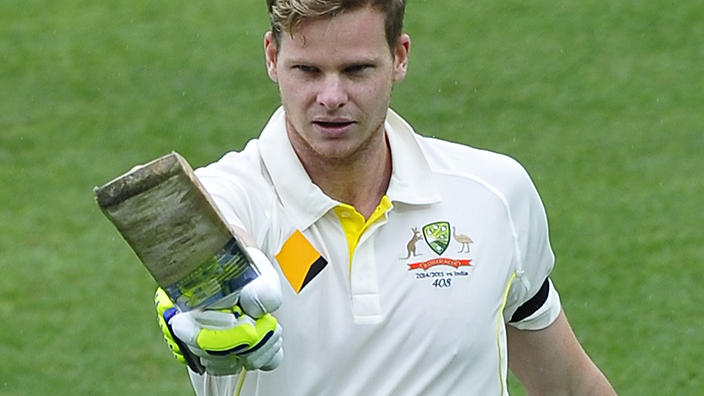 Steve Smith celebrates 100 runs on day 2 of the first Test match between Australia and India at the Adelaide Oval in Adelaide, Wednesday, Dec. 10, 2014. (AAP Image/David Mariuz ) NO ARCHIVING, EDITORIAL USE ONLY, IMAGES TO BE USED FOR NEWS REPORTING PURPOSES ONLY, NO COMMERCIAL USE WHATSOEVER, NO USE IN BOOKS WITHOUT PRIOR WRITTEN CONSENT FROM AAP