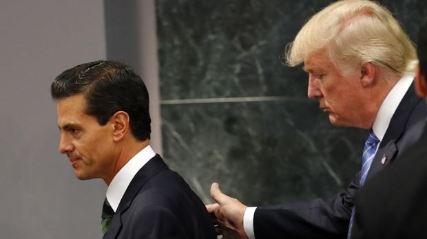 Donald Trump meets President Pena Nieto during his Mexico visit last year.–File photo