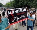 Demonstrators Hold Signs And Chant Slogans As They March In Solidarity With The People Of Kashmir, During A Rally In Karachi
