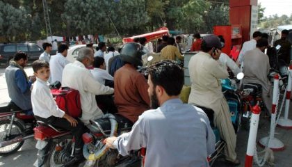Minister Distributes Free Fuel To Motorcyclists Displaying Pakistani Flags On Independence Day