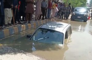 Car Sinks Into Ground Near Karachis Tariq Road Woman Rescued